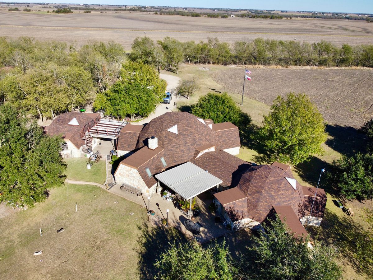 Aerial view of new architectural shingle roof installation